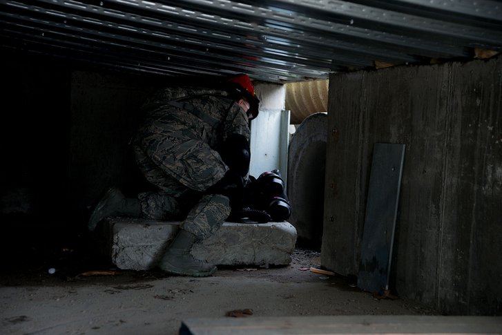 Senior Airman Tanya Rego, a medic from the 102nd Medical Group, Massachusetts Air National Guard, prepares to enter a tunnel during a confined space search and rescue mission. (Photo: Sgt. Steven Eaton/Public Domain)