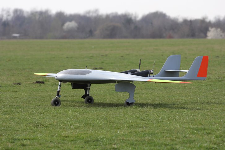 The prototype is a composite flying wing with a range of 200 km, top speed of 180 km/h which is able to remain in the air for 20 hours.